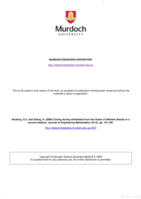 Coning during withdrawal from two fluids of different density in a porous medium
