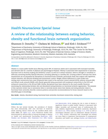 A review of the relationship between eating behavior, obesity and functional brain network organization